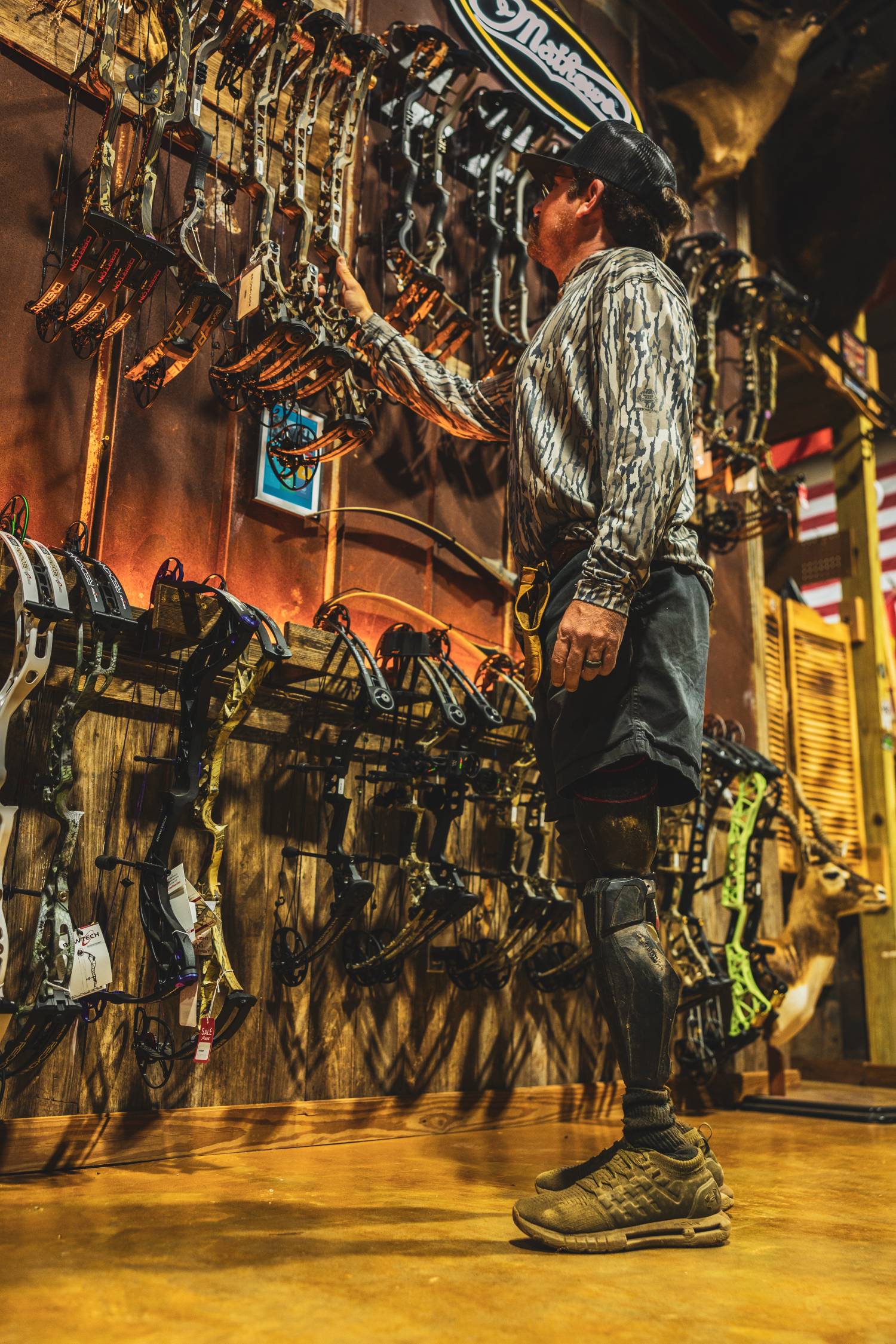 man looking at bows