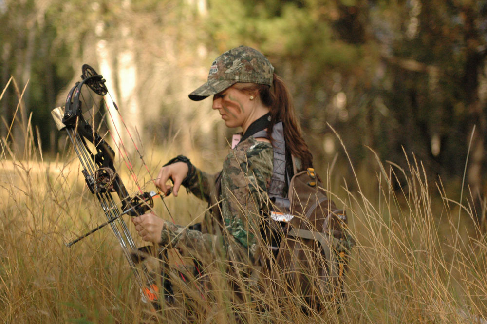 female hunter with bow