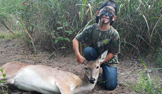 Colton Jones with a doe