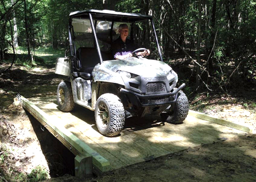 ATV crossing bridge