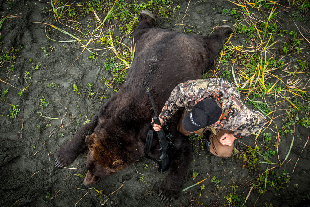 hunter with bear
