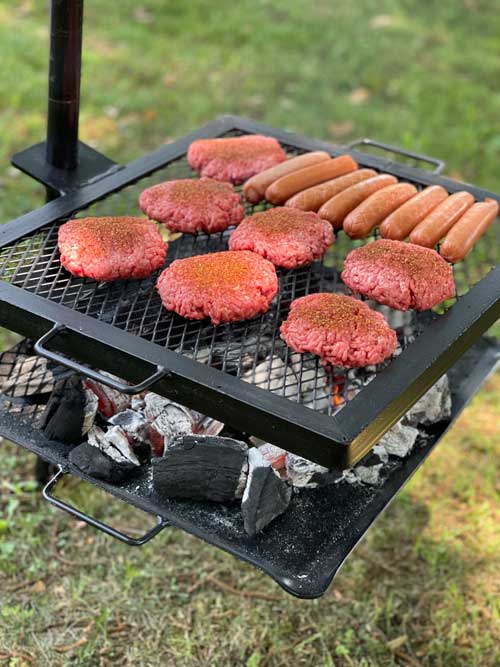 gravity grill with burgers and sausages