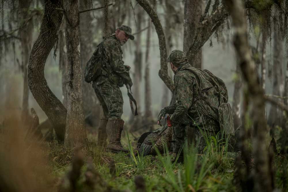 2 men turkey hunting