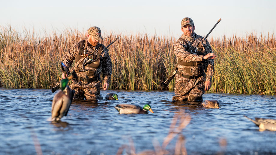 duck hunters throwing decoys