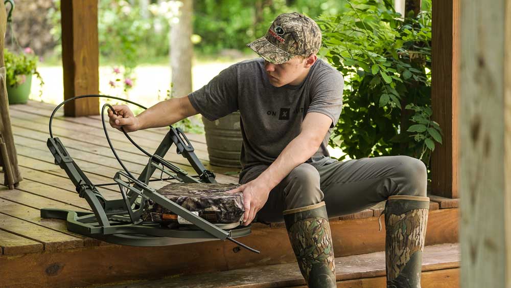 checking treestand straps and cables