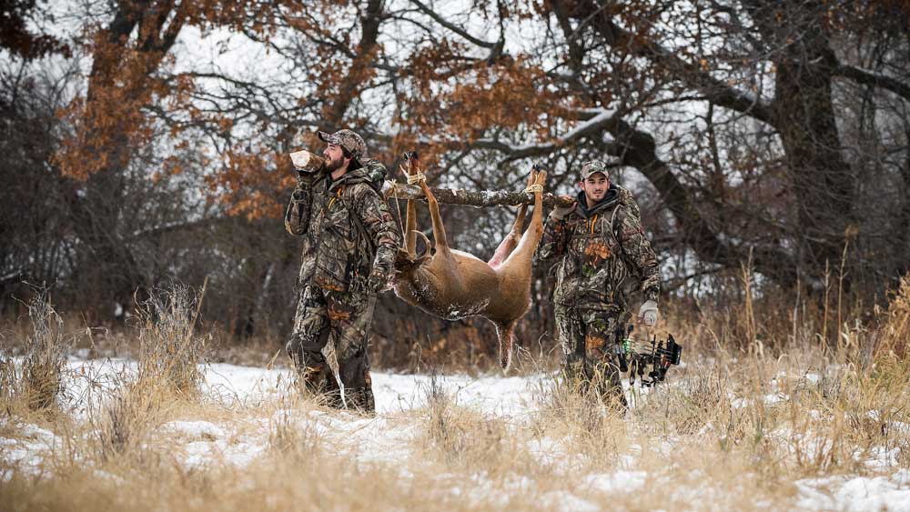 carrying a deer carcass