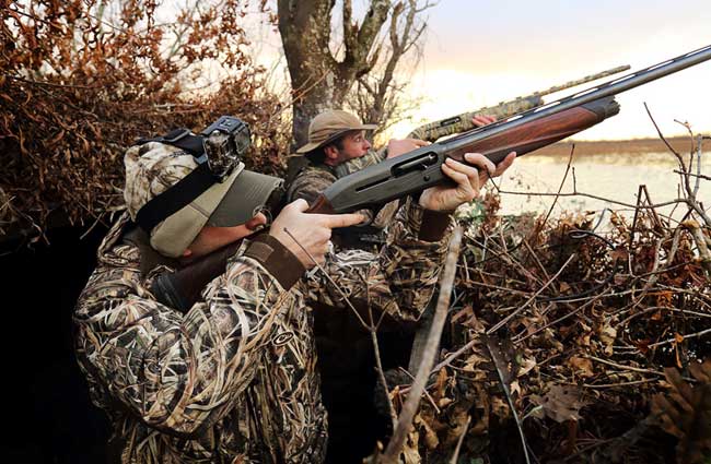 Two Duck Hunters Shooting