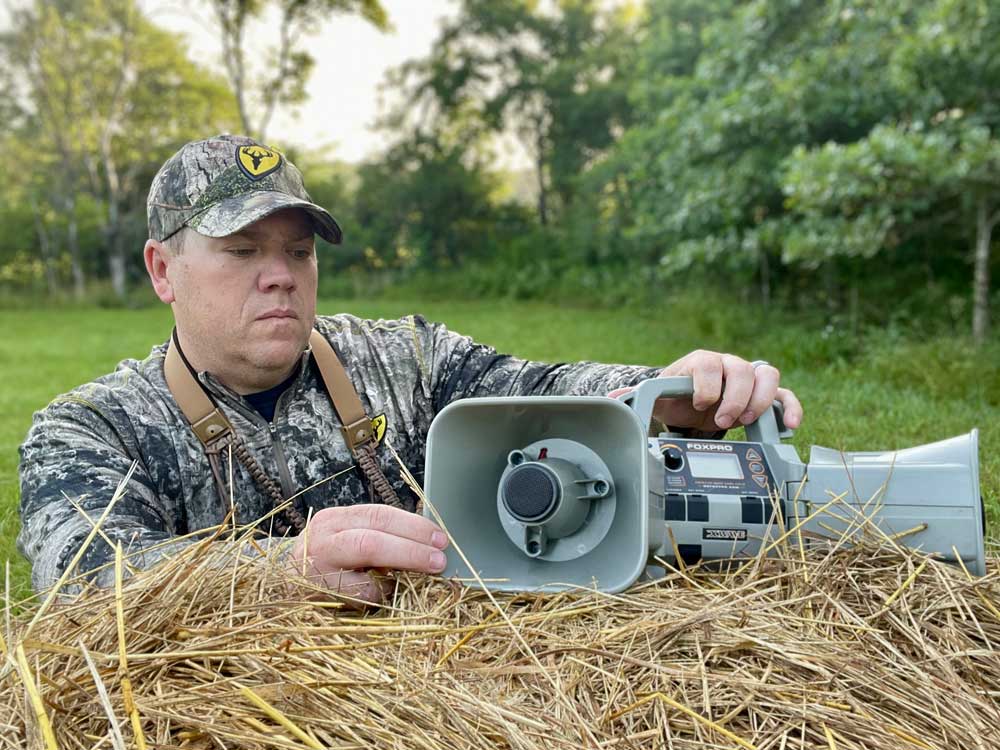 Heath Wood coyote call on hay bale