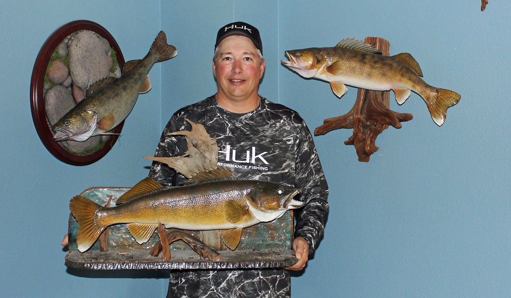 Johnnie Candle with mounted walleye