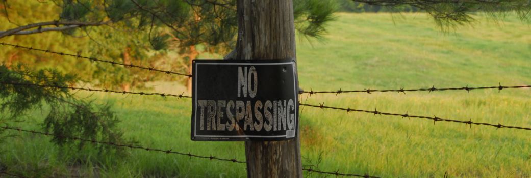 No Trespassing Sign on Fence Post