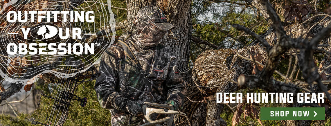mossy oak ad, man in a tree with rattling antlers