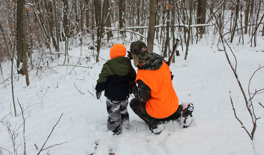 female hunter with child