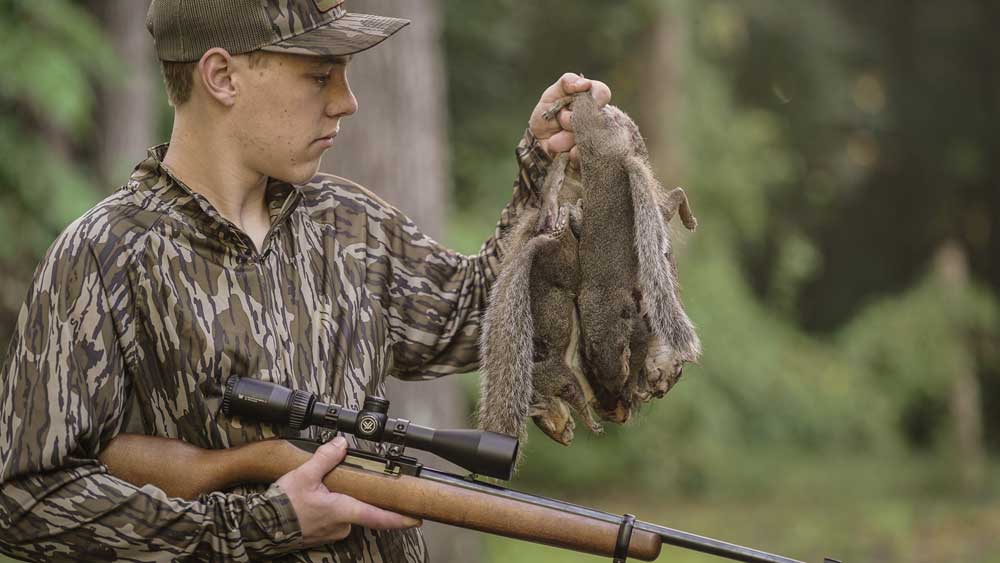 boy with squirrels Ruger 10-22