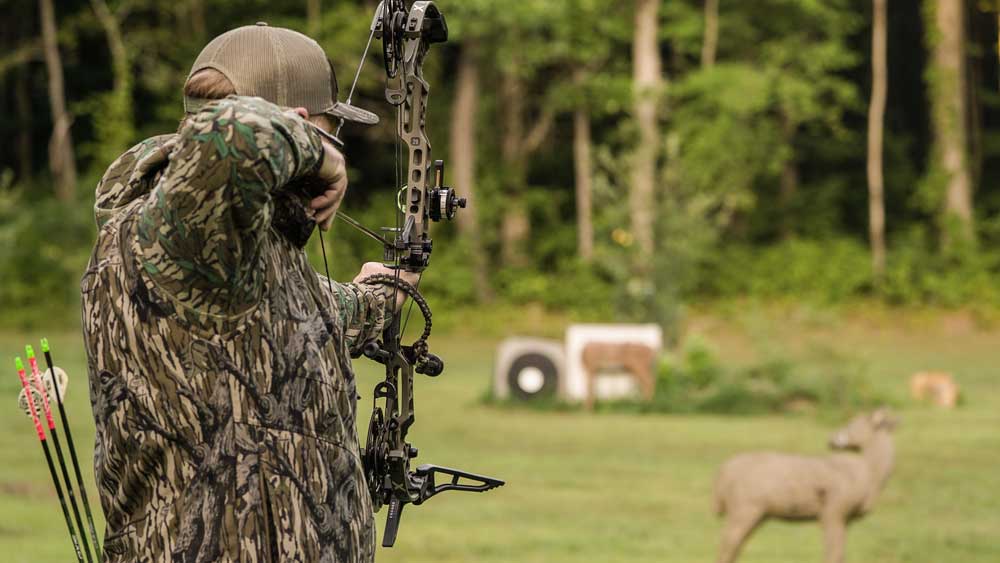 bowhunter with targets