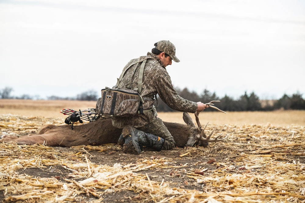 hunter with buck