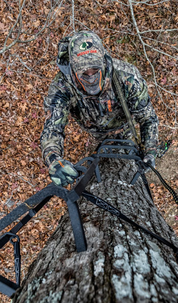 hunter climbing a treestand