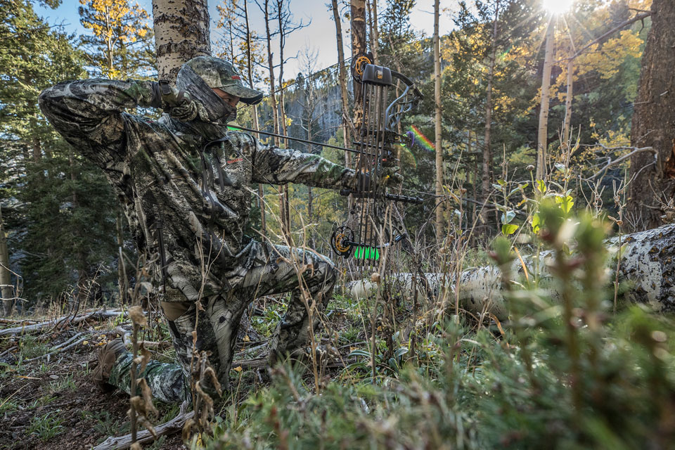 bowhunter in mountain country