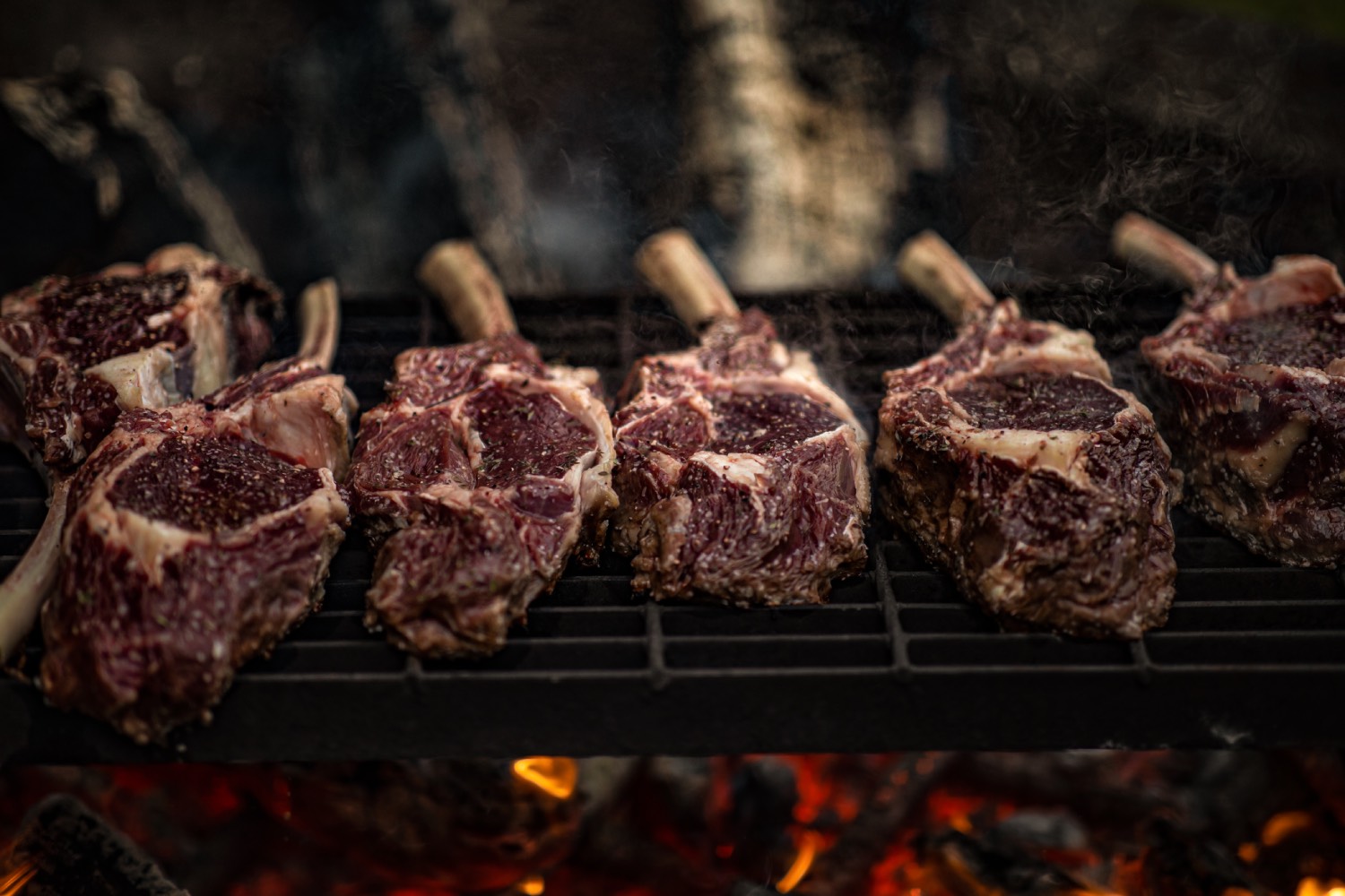 bison tomahawks lined in a row, uncooked