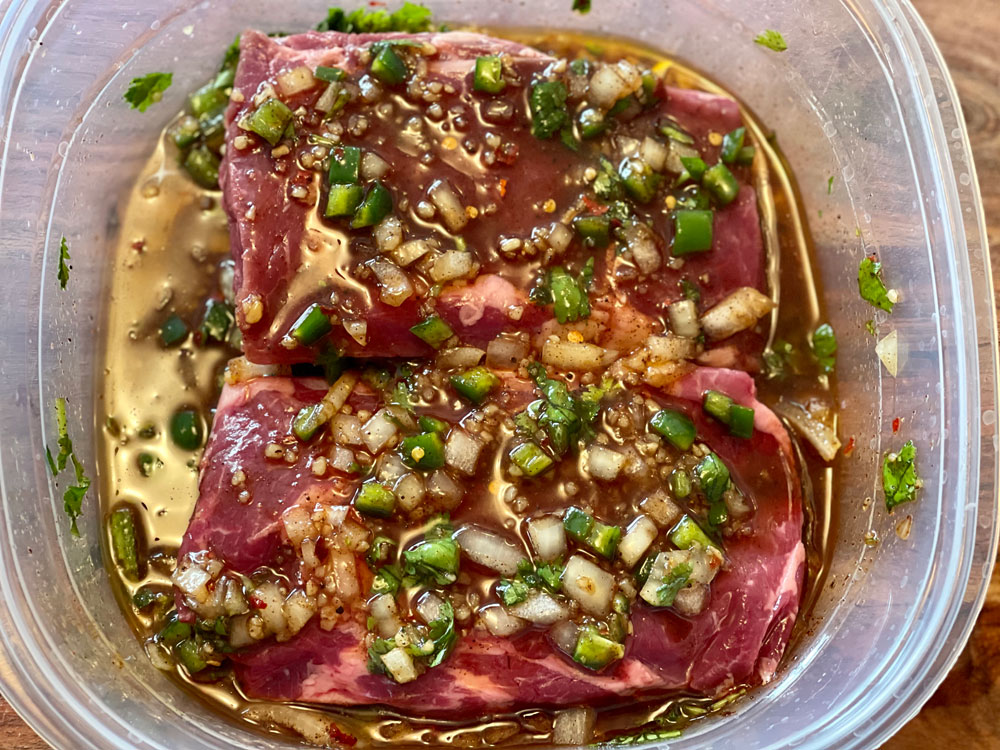 marinating bison ribeyes