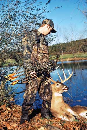 bowhunter with buck