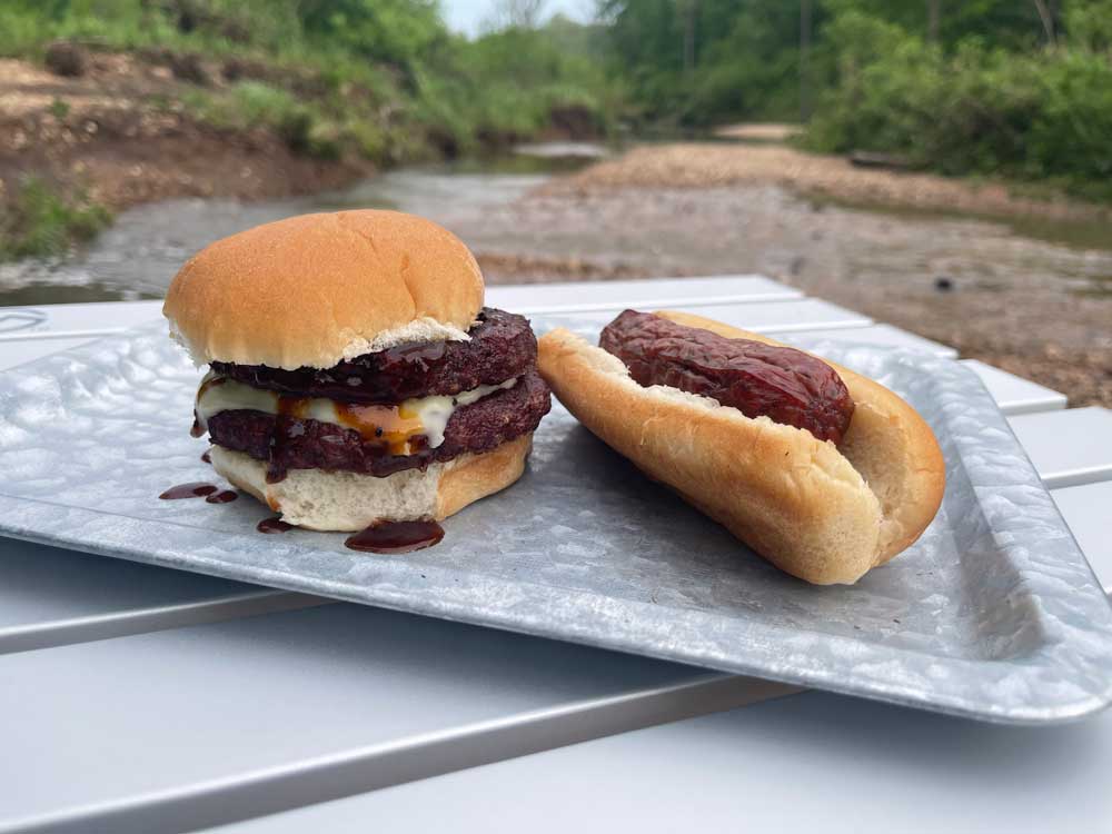 burger and sausages outdoors cooking