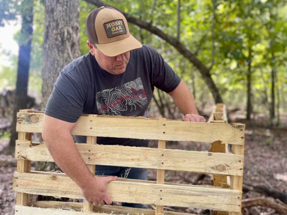 constructing blind with wooden pallets