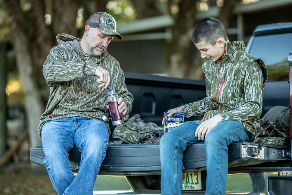 dad and son on tailgate