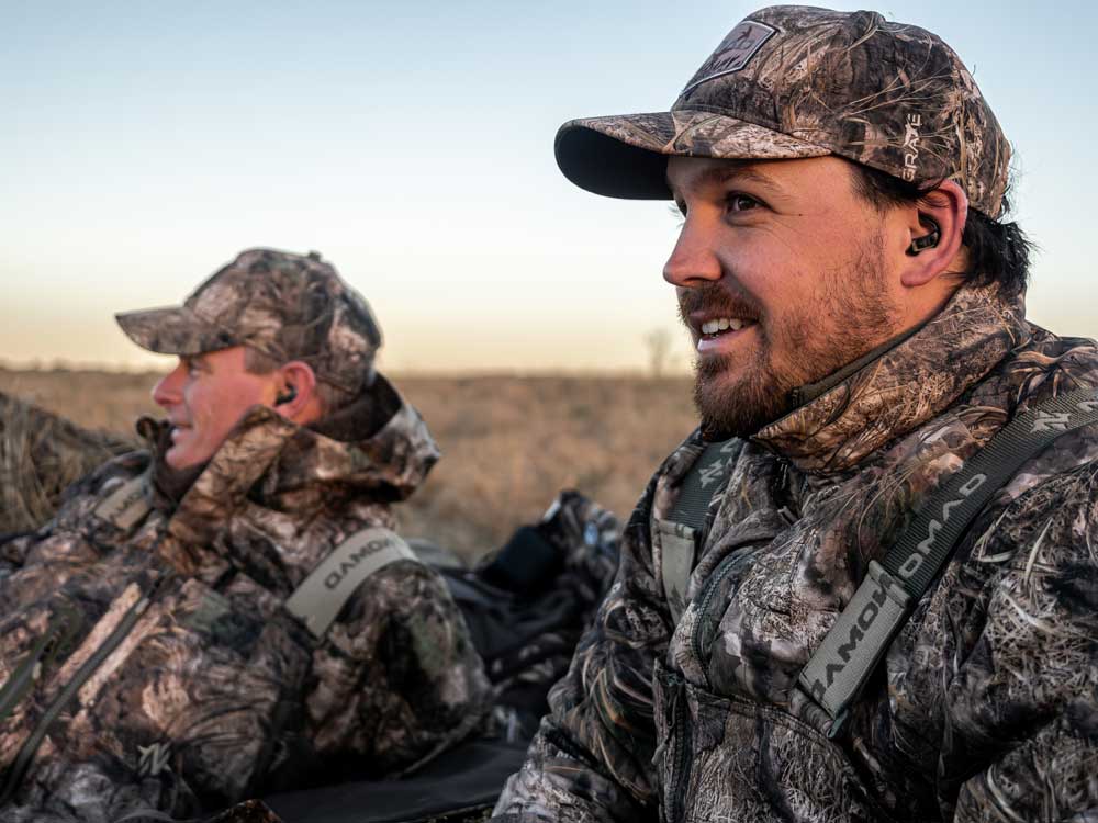 duck hunters in layout blind