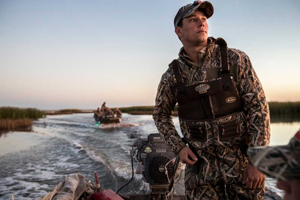 duck hunters on boats