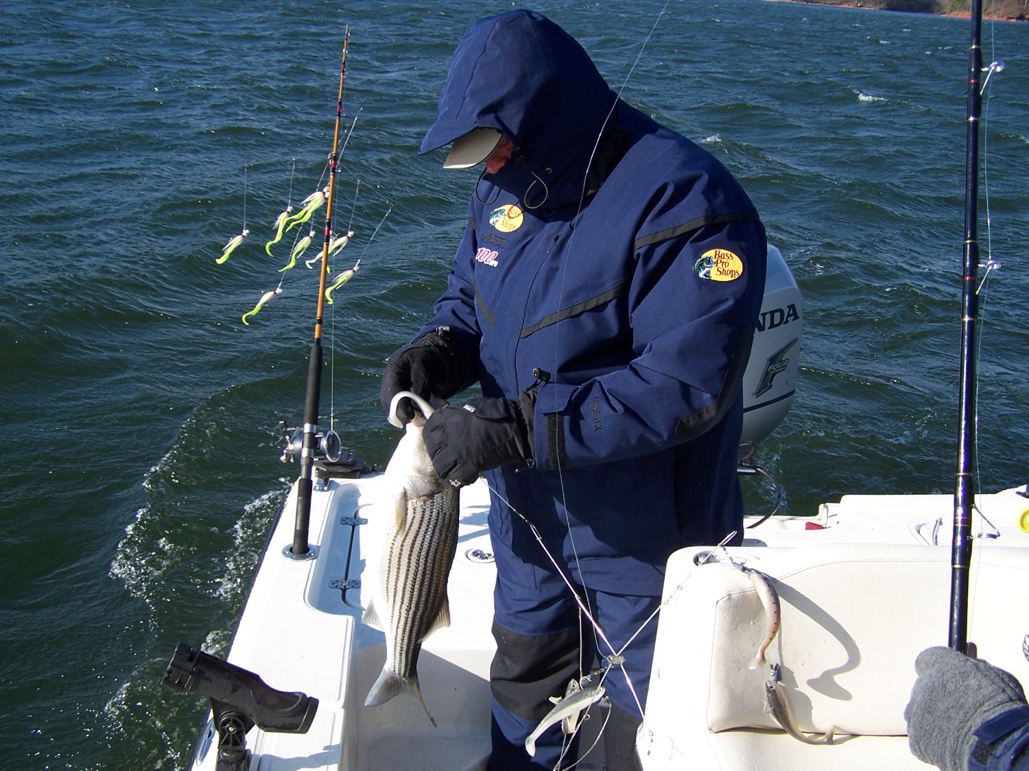 man fishes for stripers in high wind