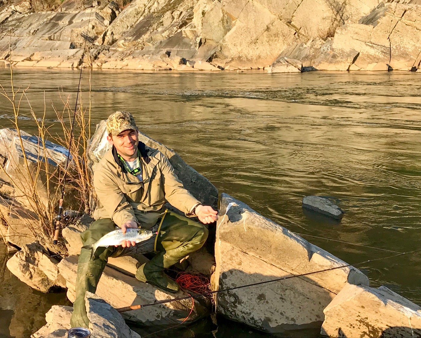 man holding a freshwater shad