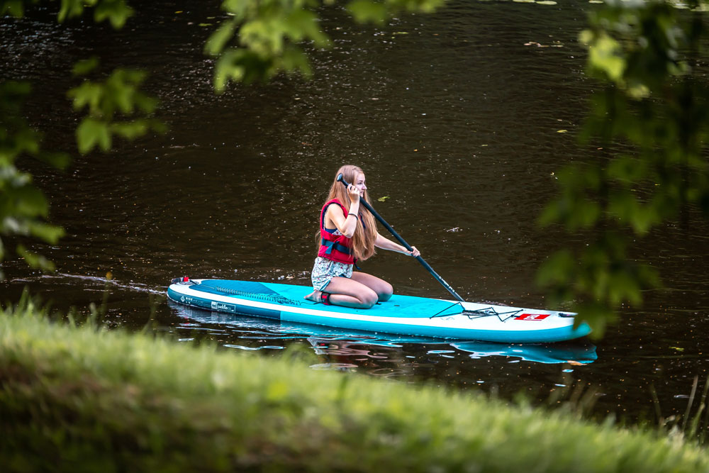 girl paddle boarding