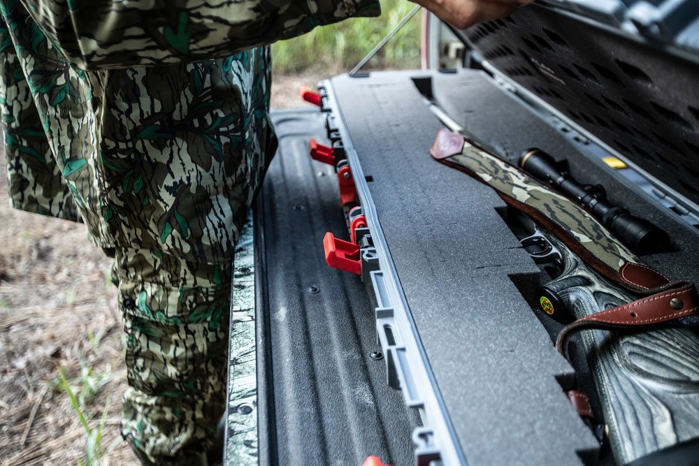 hunting rifle on tailgate