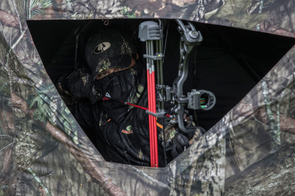 bowhunter in ground blind