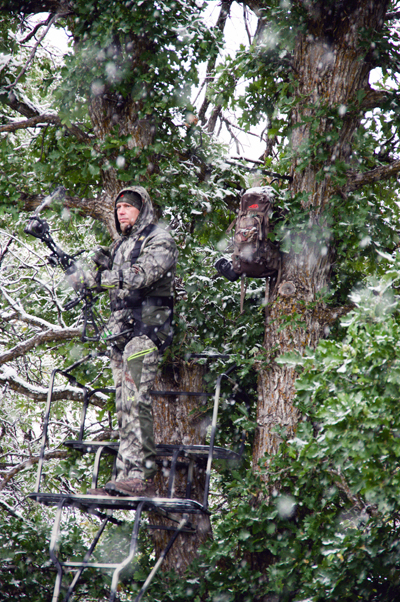 hunter in ladder stand