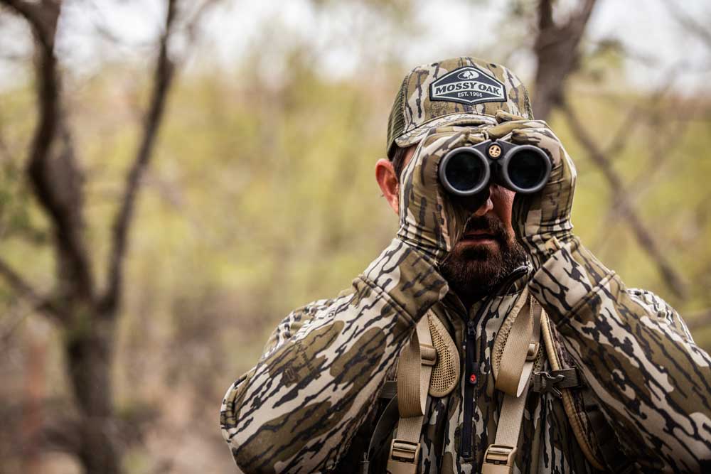 hunter looking through binoculars