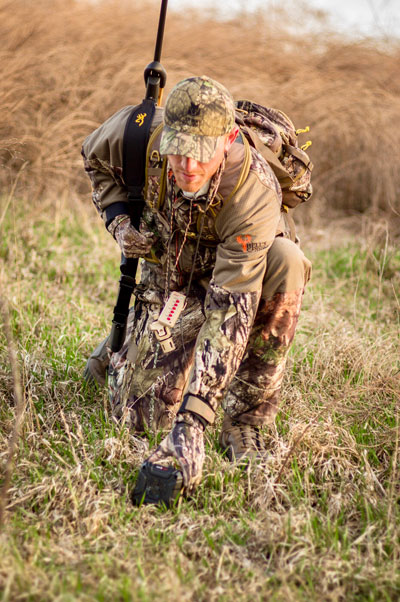 hunter placing predator call