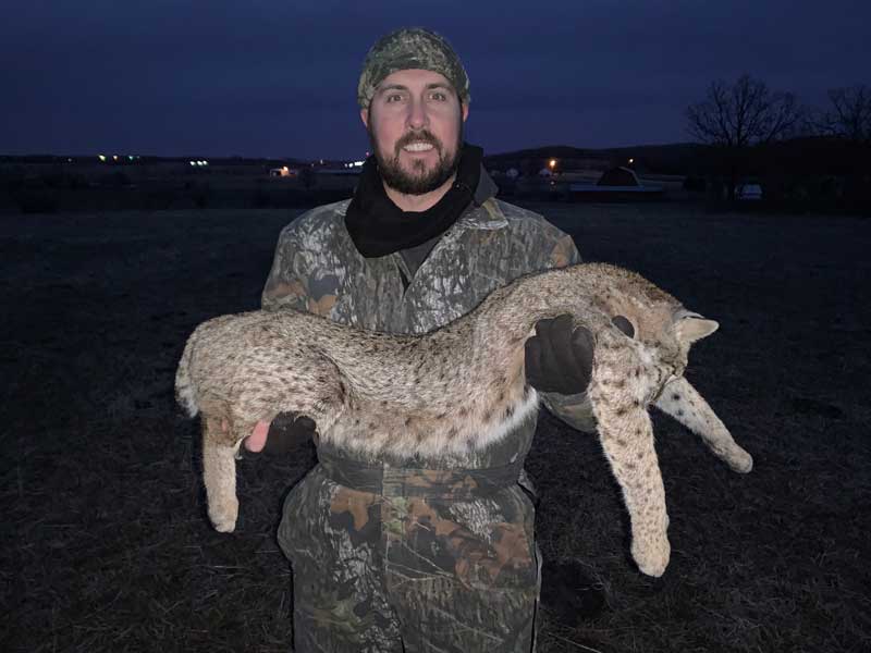 hunter with bobcat