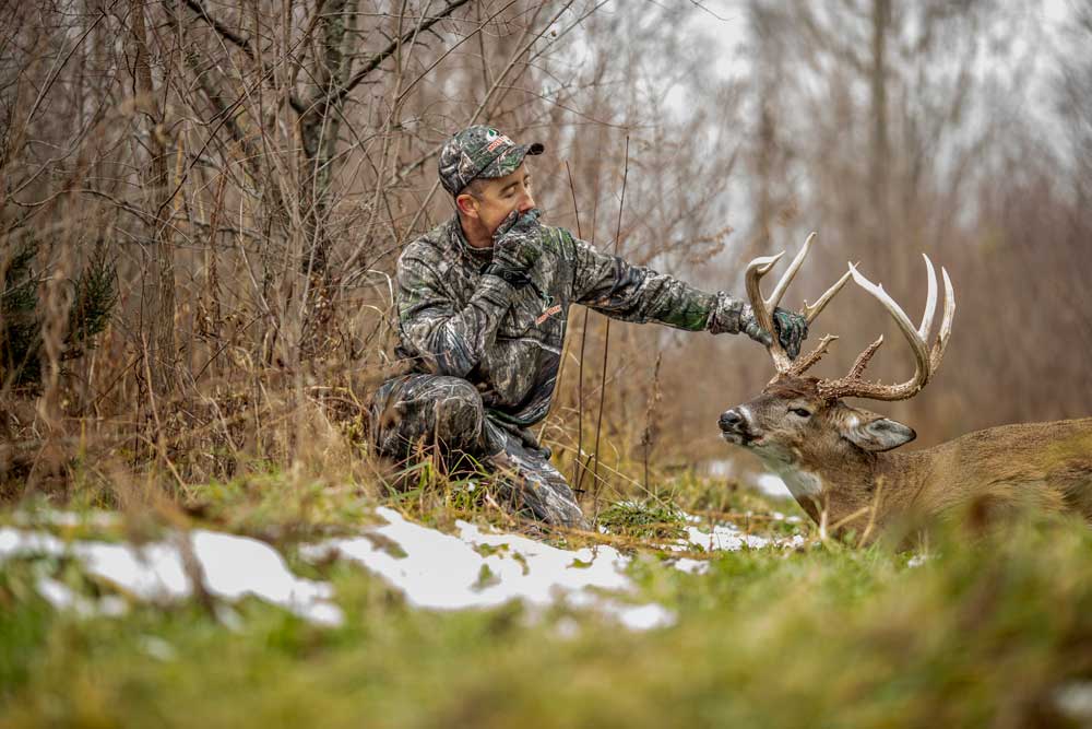 HUNTER WITH BUCK TROPHY