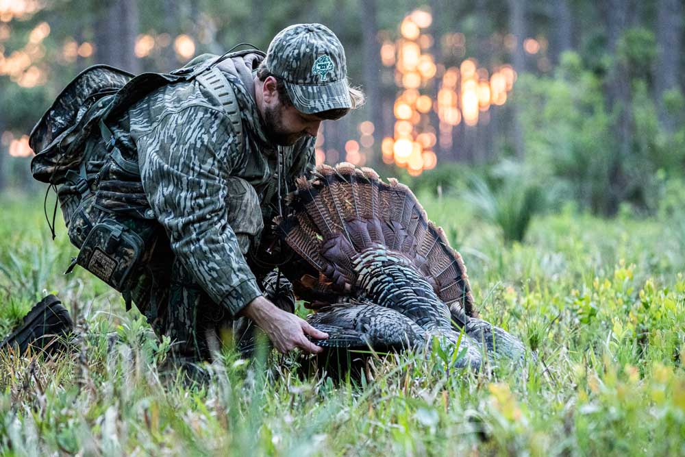 hunter with turkey trophy