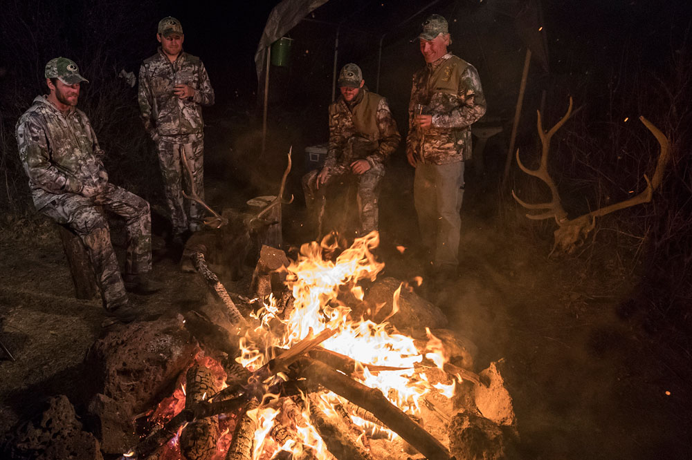 hunters around campfire