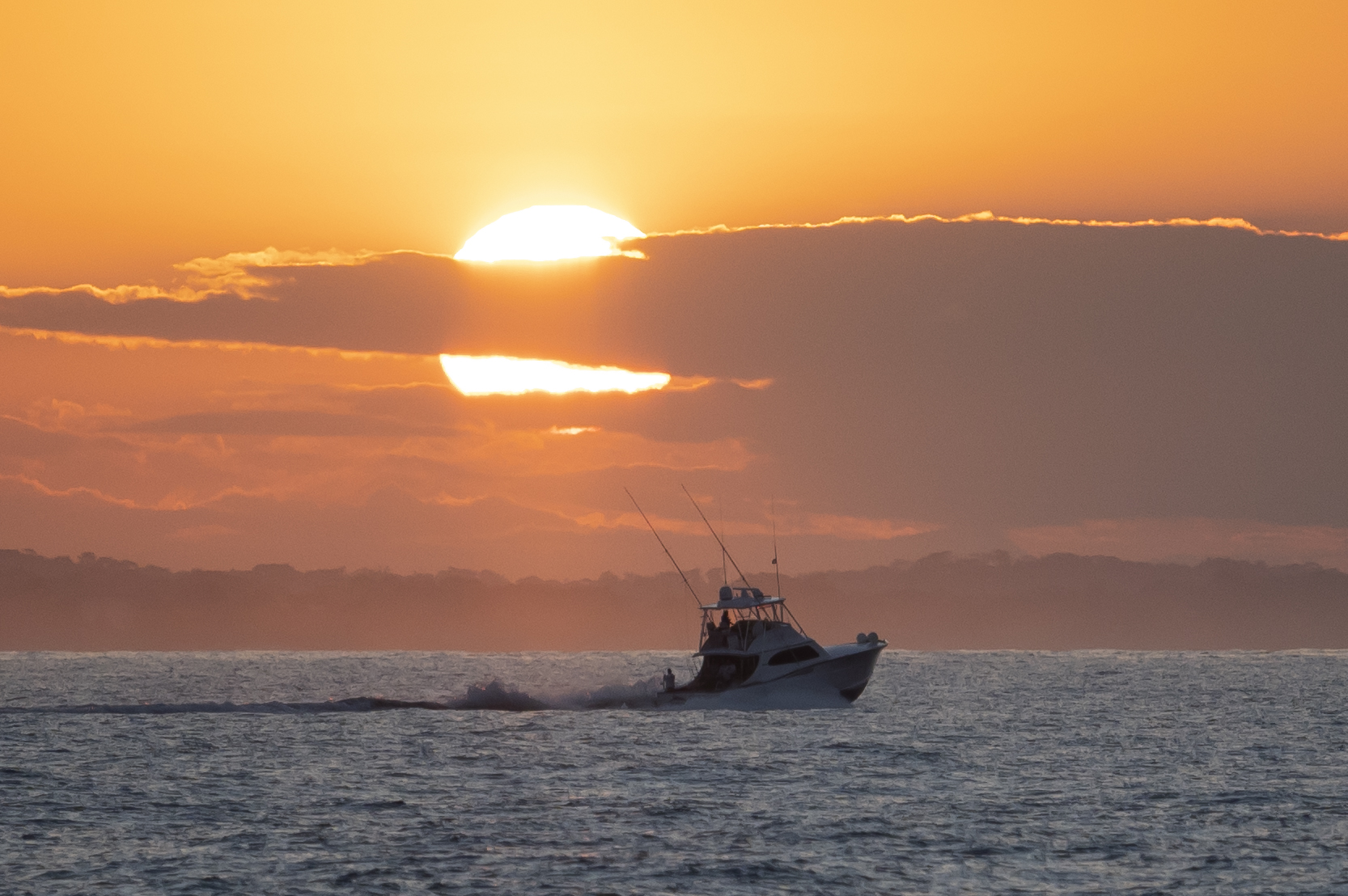 sunset and a boat on the ocean