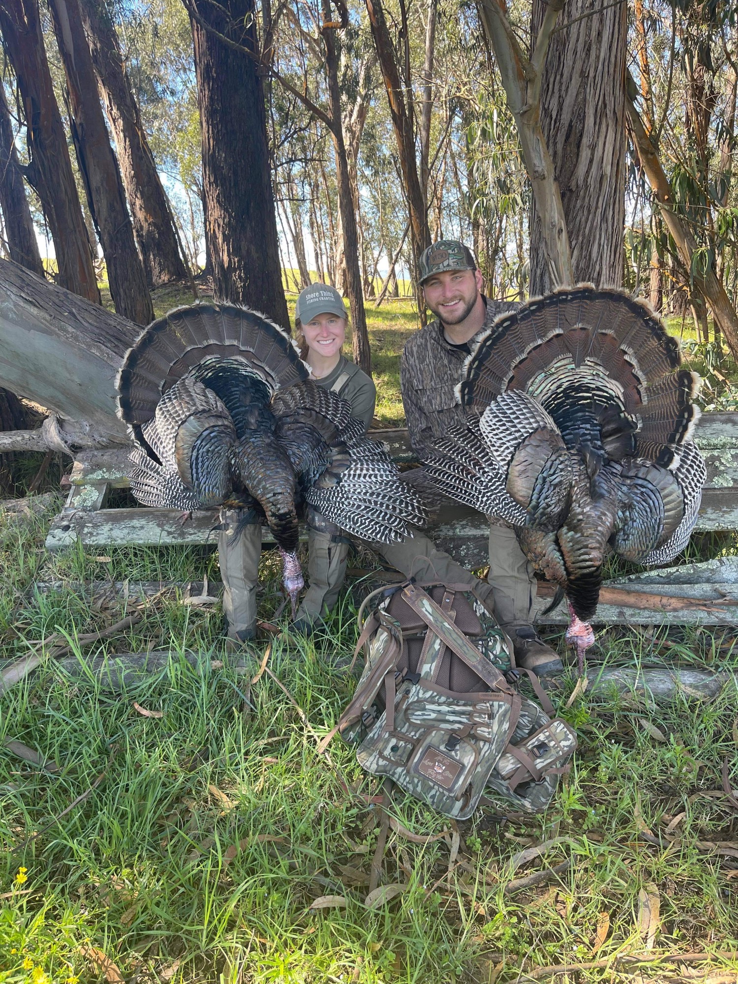 Jeremy and his wife pose with their two turkey kills