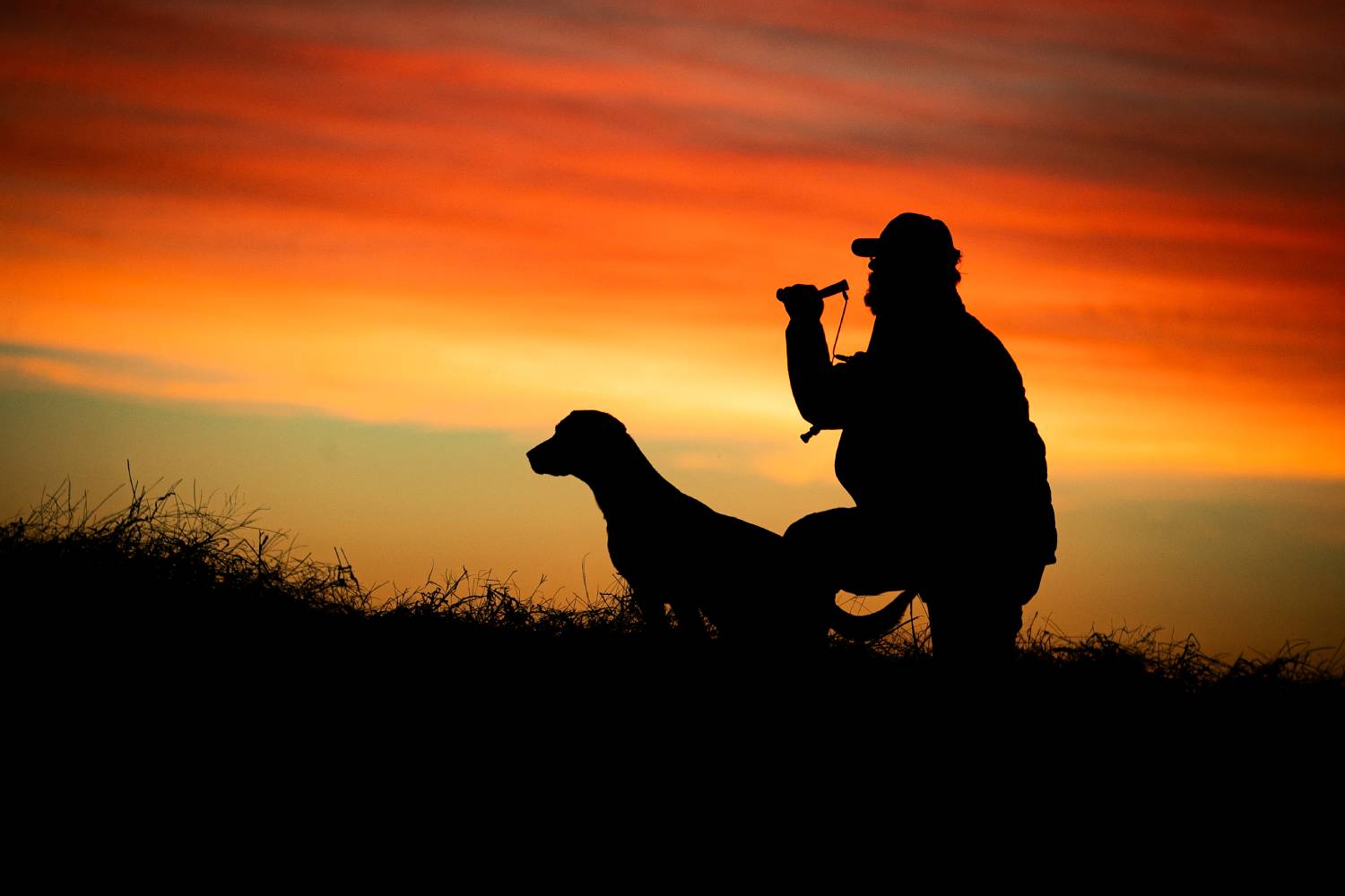 man silhouetted in the sunrise