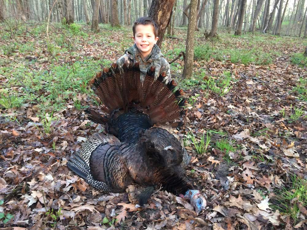 kid with turkey