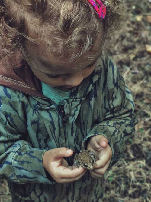 little hunter with frog