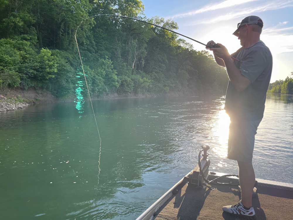 smallmouth bass fishing sunset