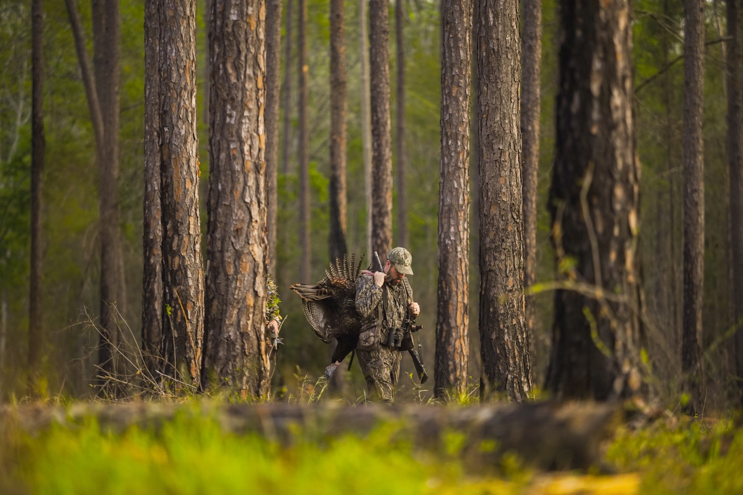 man walks with a turkey