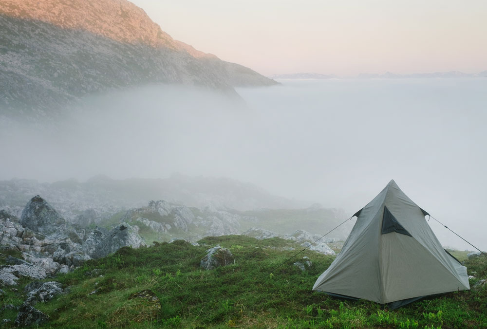 tent in foggy mountains