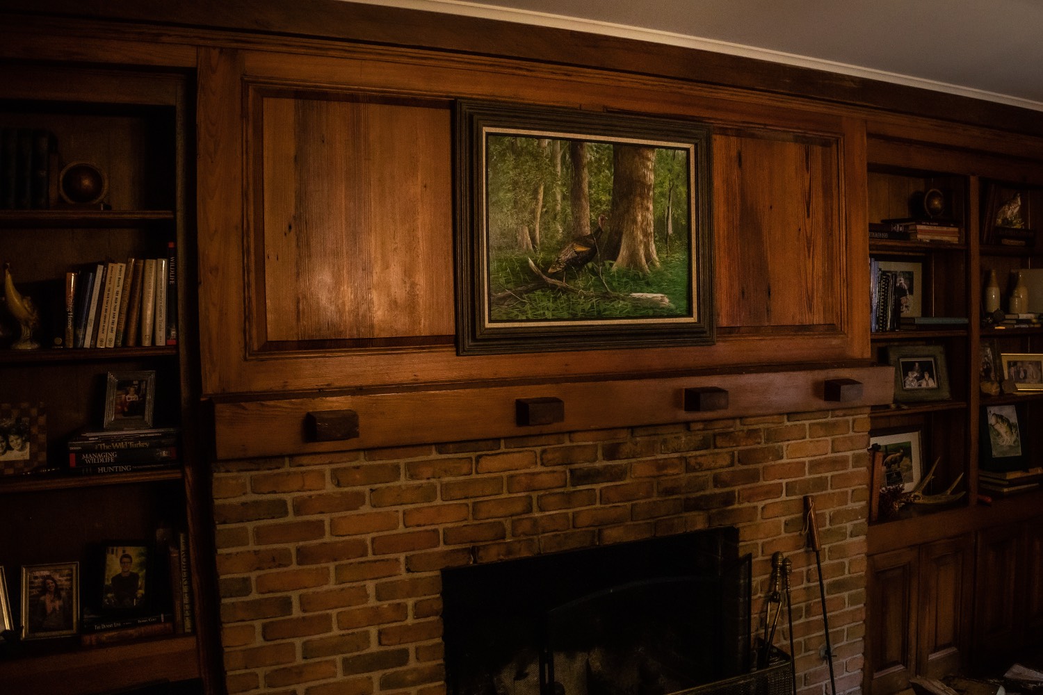 stamp artwork displayed above fireplace